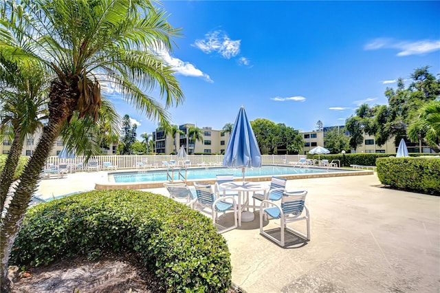 14130 Rosemary Ln Unit 4215, Largo, FL 33774 - community pool with a patio area