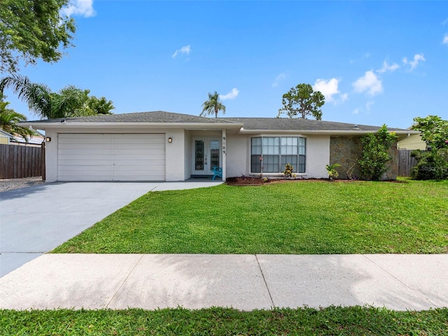 9109 134th Way, Seminole, FL 33776 - ranch-style home with stucco siding, an attached garage, french doors, and concrete driveway