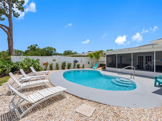 9109 134th Way, Seminole, FL 33776 - view of pool featuring a sunroom, french doors, a patio area, and a fenced backyard