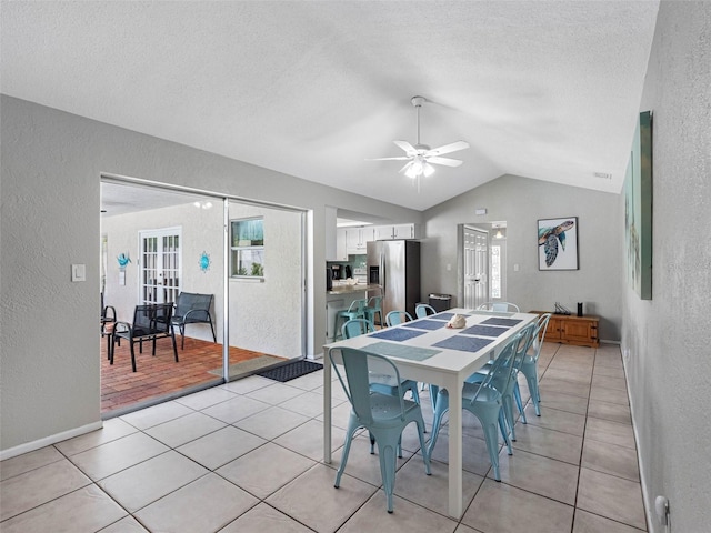 9109 134th Way, Seminole, FL 33776 - dining area with a textured wall, a ceiling fan, vaulted ceiling, plenty of natural light, and a textured ceiling