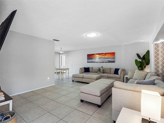 9109 134th Way, Seminole, FL 33776 - living room with light tile patterned floors and baseboards