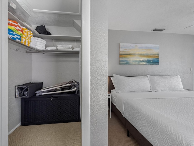 9109 134th Way, Seminole, FL 33776 - bedroom featuring a textured wall and carpet