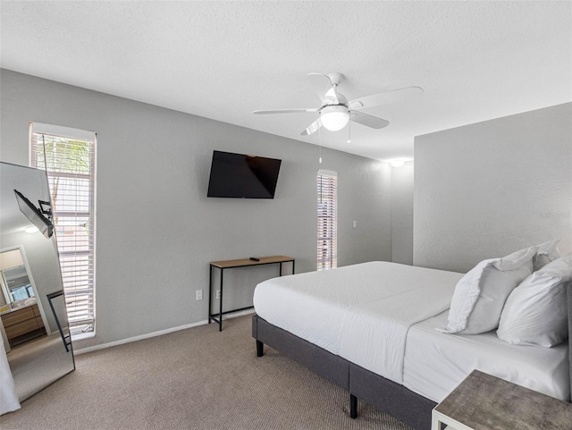 9109 134th Way, Seminole, FL 33776 - bedroom with carpet flooring, ceiling fan, and a textured ceiling