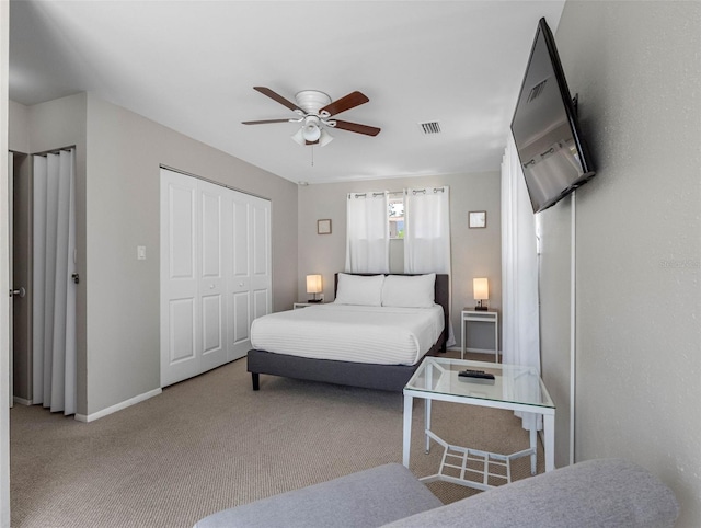 9109 134th Way, Seminole, FL 33776 - carpeted bedroom featuring a closet and ceiling fan