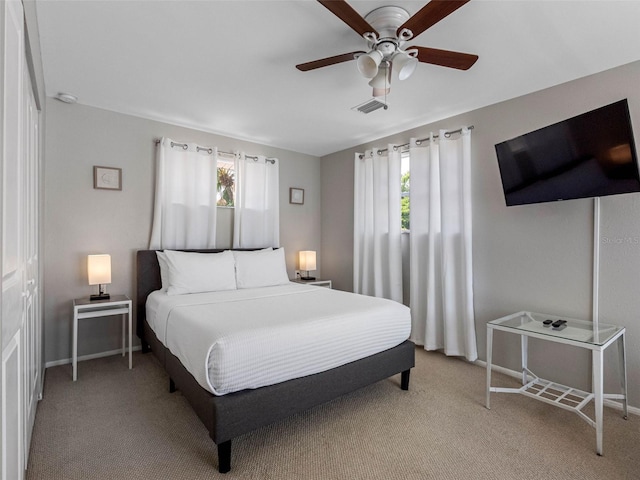 9109 134th Way, Seminole, FL 33776 - bedroom featuring light carpet and ceiling fan