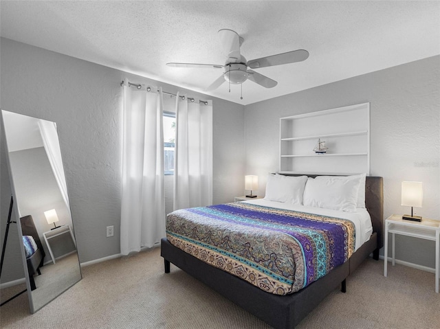 9109 134th Way, Seminole, FL 33776 - bedroom featuring carpet flooring, a ceiling fan, a textured wall, and a textured ceiling