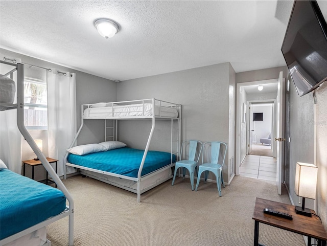9109 134th Way, Seminole, FL 33776 - bedroom featuring carpet flooring and a textured ceiling