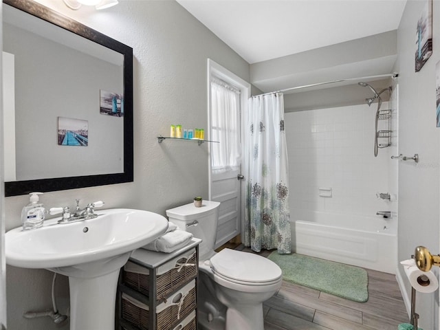 9109 134th Way, Seminole, FL 33776 - bathroom with shower / bath combination with curtain and wood finished floors