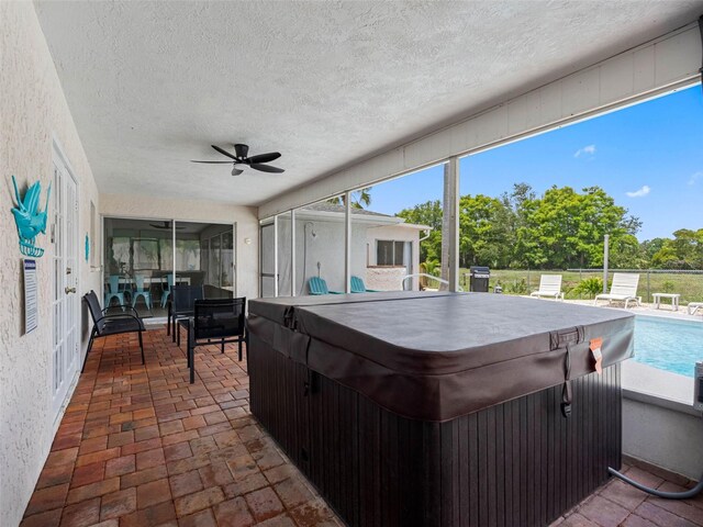 9109 134th Way, Seminole, FL 33776 - sunroom / solarium with a hot tub and a ceiling fan