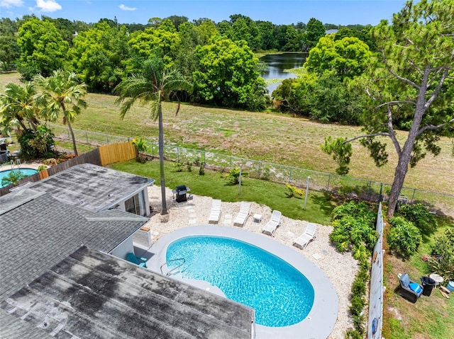 9109 134th Way, Seminole, FL 33776 - view of swimming pool with a fenced backyard, a water view, and a patio area