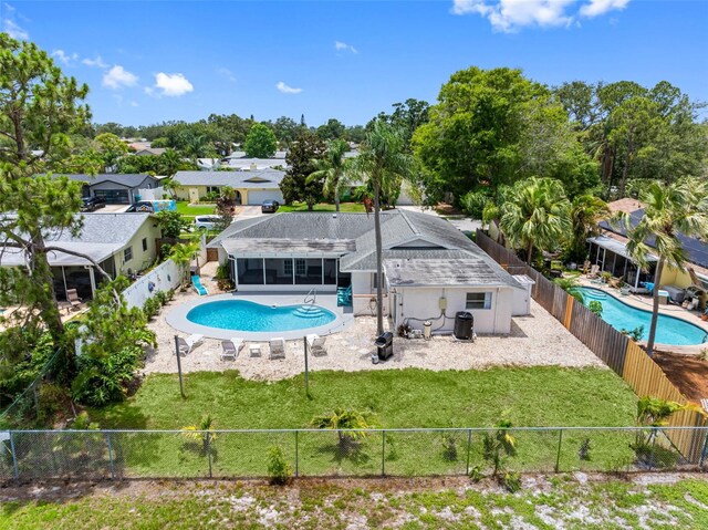 9109 134th Way, Seminole, FL 33776 - view of swimming pool featuring a fenced backyard, a patio, and a residential view