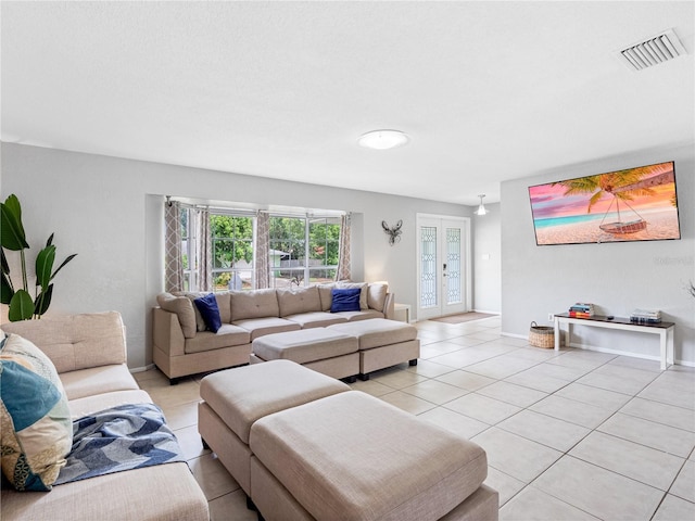 9109 134th Way, Seminole, FL 33776 - living area with light tile patterned flooring and french doors