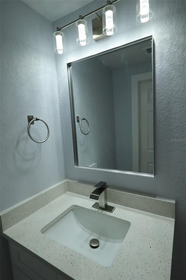 8405 N Willow Ave, Tampa, FL 33604 - bathroom featuring vanity and a textured wall