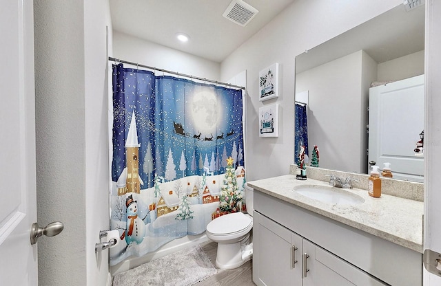 3329 Fresno Pl, Zephyrhills, FL 33541 - bathroom with vanity, shower / bath combo, and wood finished floors