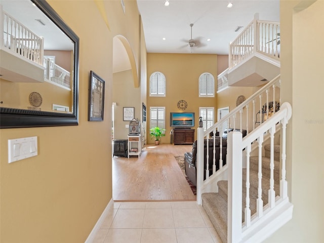 8222 Haven Harbour Way, Bradenton, FL 34212 - tiled foyer with a ceiling fan, stairway, a high ceiling, and recessed lighting