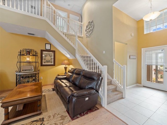 8222 Haven Harbour Way, Bradenton, FL 34212 - tiled living room featuring a high ceiling and stairs