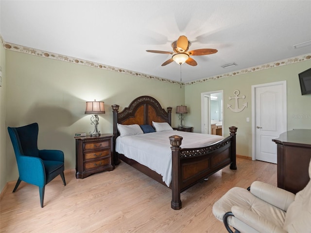 8222 Haven Harbour Way, Bradenton, FL 34212 - bedroom featuring light wood-style floors, ensuite bath, and ceiling fan