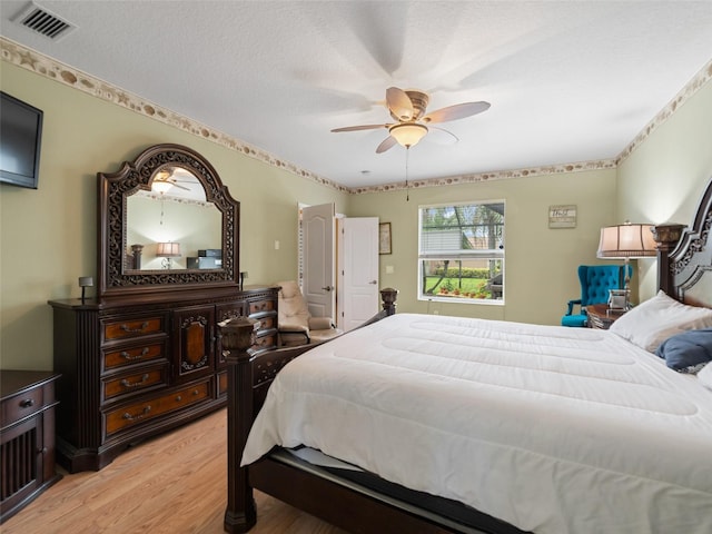 8222 Haven Harbour Way, Bradenton, FL 34212 - bedroom featuring light wood finished floors and ceiling fan