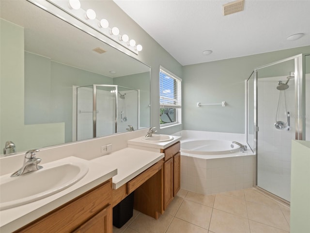8222 Haven Harbour Way, Bradenton, FL 34212 - full bathroom featuring a shower stall, double vanity, tile patterned floors, and a garden tub