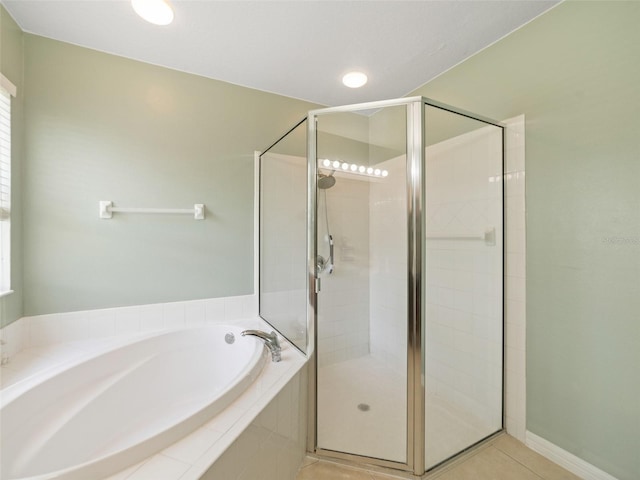 8222 Haven Harbour Way, Bradenton, FL 34212 - bathroom featuring a bath, a shower stall, and tile patterned flooring