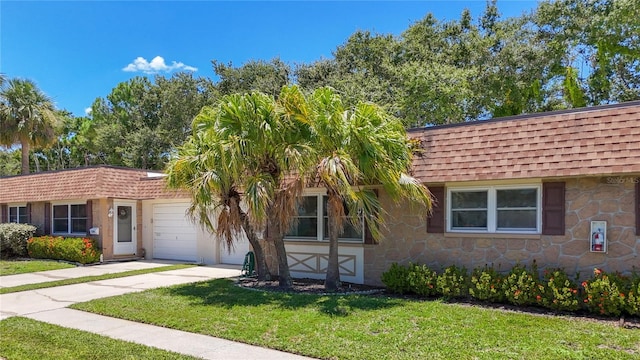1102 Cara Dr, Largo, FL 33771 - front facade with roof with shingles, a garage, driveway, a front lawn, and stone siding