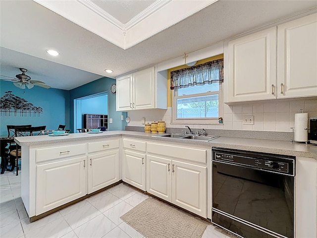 1102 Cara Dr, Largo, FL 33771 - kitchen with black dishwasher, a peninsula, a ceiling fan, white cabinets, and recessed lighting