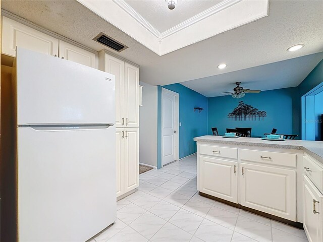 1102 Cara Dr, Largo, FL 33771 - kitchen featuring freestanding refrigerator, a ceiling fan, white cabinets, light countertops, and recessed lighting