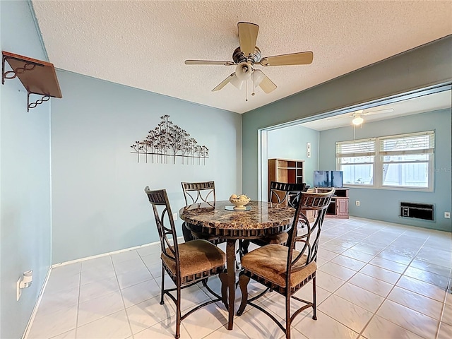 1102 Cara Dr, Largo, FL 33771 - dining space featuring light tile patterned floors, ceiling fan, and a textured ceiling