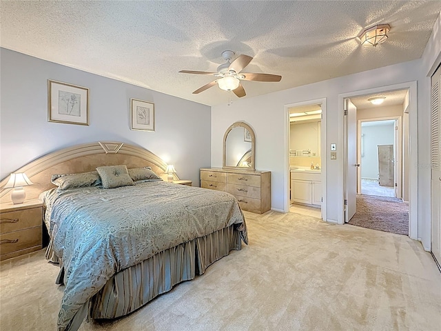 1102 Cara Dr, Largo, FL 33771 - bedroom featuring light carpet, a textured ceiling, ensuite bathroom, and a ceiling fan