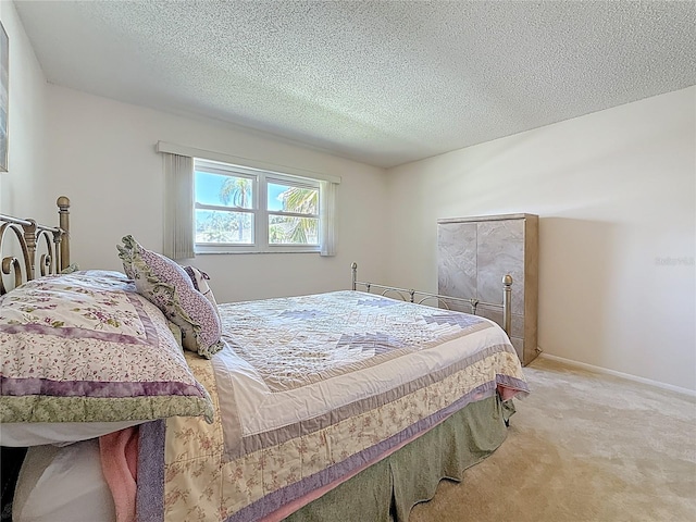 1102 Cara Dr, Largo, FL 33771 - bedroom featuring light colored carpet and a textured ceiling