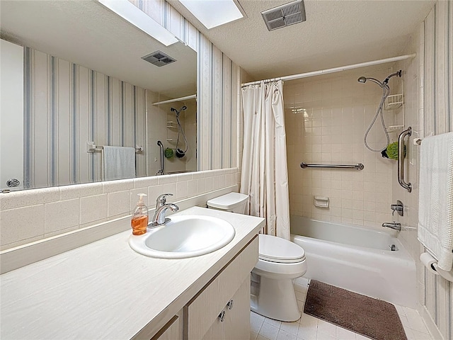 1102 Cara Dr, Largo, FL 33771 - bathroom featuring shower / bath combo with shower curtain, vanity, tile patterned floors, wallpapered walls, and a textured ceiling