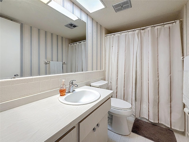 1102 Cara Dr, Largo, FL 33771 - bathroom featuring vanity, wallpapered walls, tile patterned flooring, curtained shower, and a textured ceiling