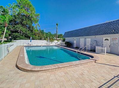 1102 Cara Dr, Largo, FL 33771 - community pool with a patio