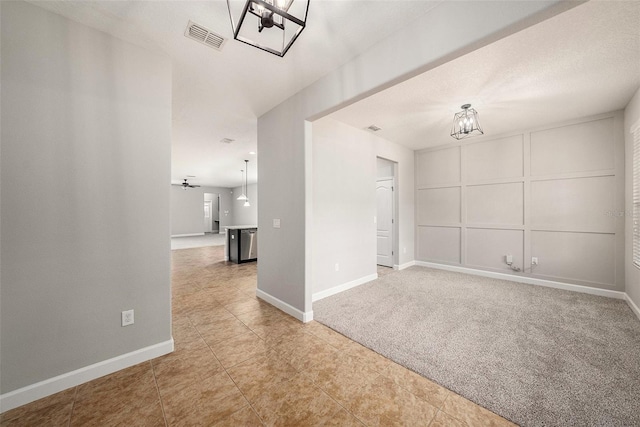 2706 Lantern Hill Ave, Brandon, FL 33511 - empty room with light tile patterned flooring and a chandelier