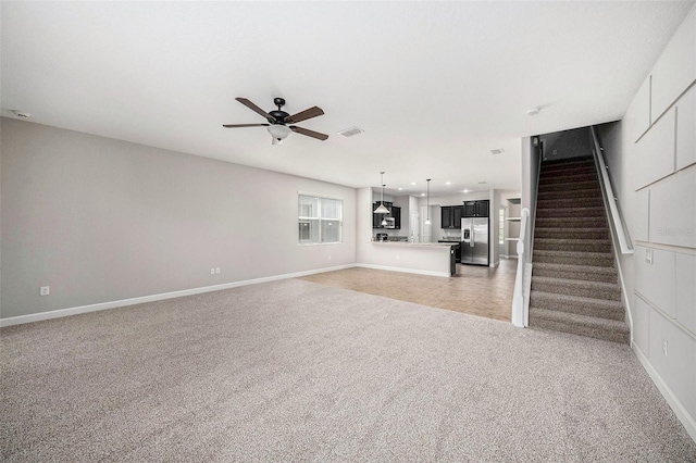 2706 Lantern Hill Ave, Brandon, FL 33511 - unfurnished living room featuring light colored carpet, a ceiling fan, stairs, and recessed lighting