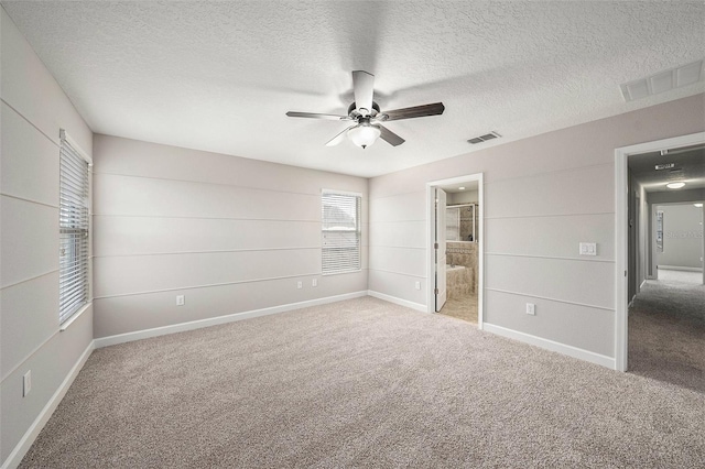 2706 Lantern Hill Ave, Brandon, FL 33511 - unfurnished bedroom featuring carpet floors, a textured ceiling, ceiling fan, and ensuite bathroom