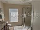 3926 N Eagle Pt, Crystal River, FL 34428 - full bathroom featuring a stall shower and vanity