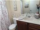 3926 N Eagle Pt, Crystal River, FL 34428 - bathroom with vanity and a shower with curtain