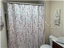 3926 N Eagle Pt, Crystal River, FL 34428 - full bath with vanity and a shower with curtain