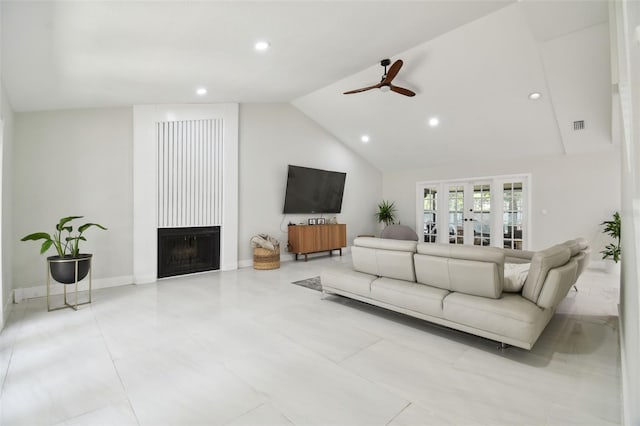 15722 Gardenside Ln, Tampa, FL 33624 - tiled living area featuring a large fireplace, ceiling fan, recessed lighting, high vaulted ceiling, and french doors
