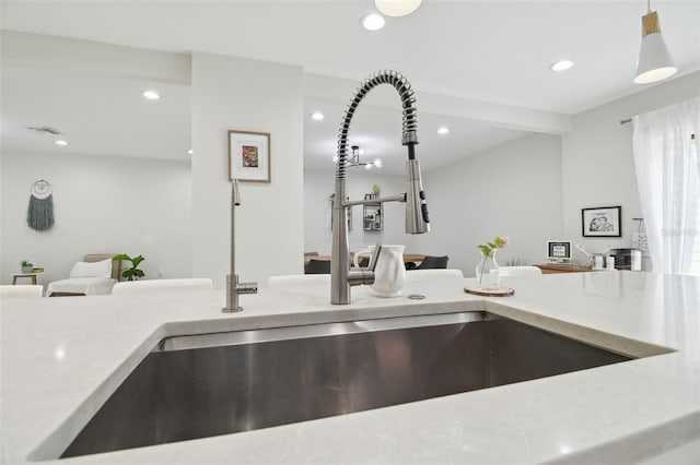 15722 Gardenside Ln, Tampa, FL 33624 - kitchen view of recessed lighting, pendant lighting, and light stone counters