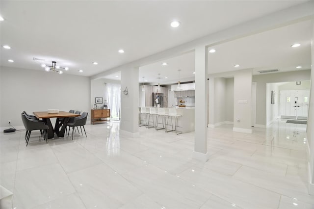 15722 Gardenside Ln, Tampa, FL 33624 - dining area with recessed lighting and baseboards