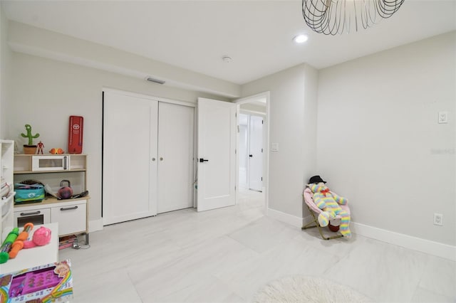 15722 Gardenside Ln, Tampa, FL 33624 - rec room with baseboards and recessed lighting