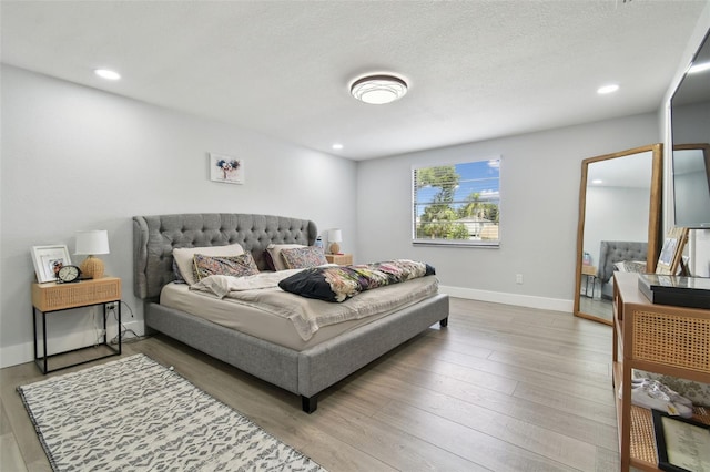 15722 Gardenside Ln, Tampa, FL 33624 - bedroom featuring wood finished floors and recessed lighting