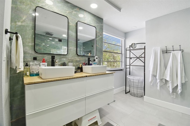 15722 Gardenside Ln, Tampa, FL 33624 - bathroom with double vanity and a shower