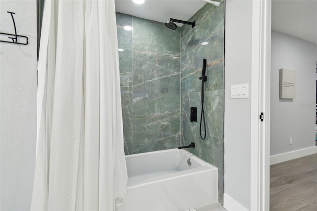 15722 Gardenside Ln, Tampa, FL 33624 - full bathroom featuring shower / bathtub combination with curtain and wood finished floors