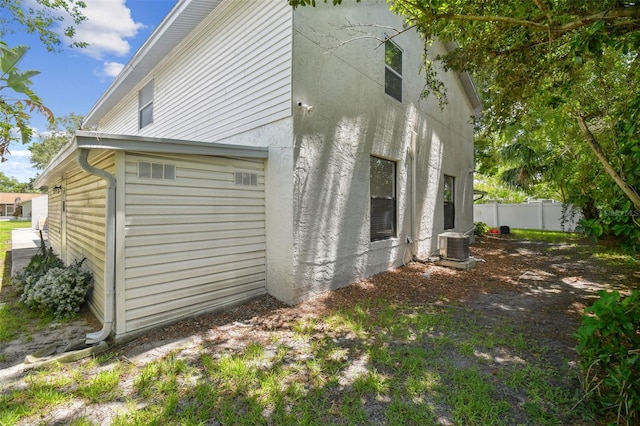 15722 Gardenside Ln, Tampa, FL 33624 - view of side of home featuring stucco siding