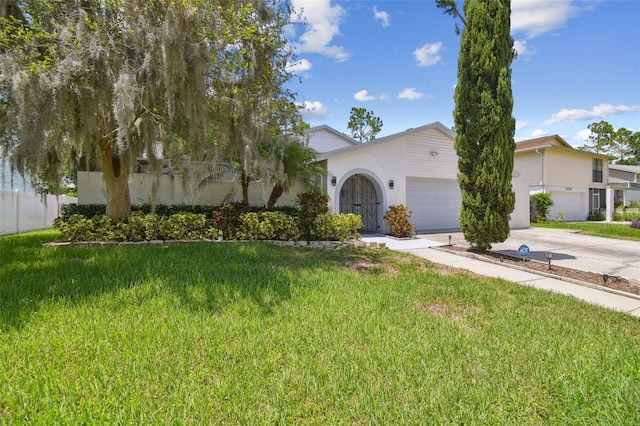 15722 Gardenside Ln, Tampa, FL 33624 - obstructed view of property featuring a garage, driveway, and stucco siding