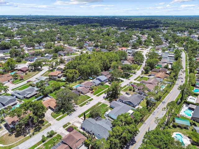 15722 Gardenside Ln, Tampa, FL 33624 - aerial overview of property's location with nearby suburban area and a pool area