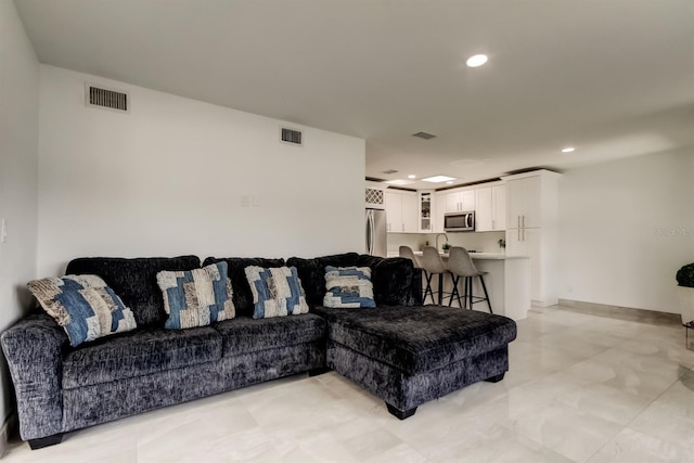 4727 Town N Country Blvd, Tampa, FL 33615 - living area featuring recessed lighting